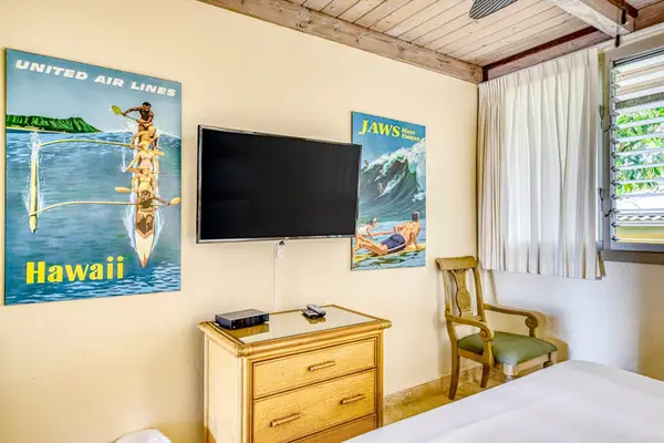 Bedroom With Smart TV And Island Comfort