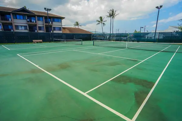 Outdoor Tennis Court Under Sunny Skies