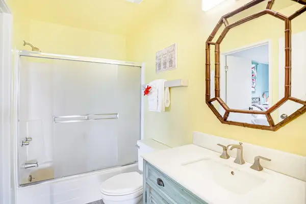 Second ensuite bathroom featuring a walk-in shower and vanity