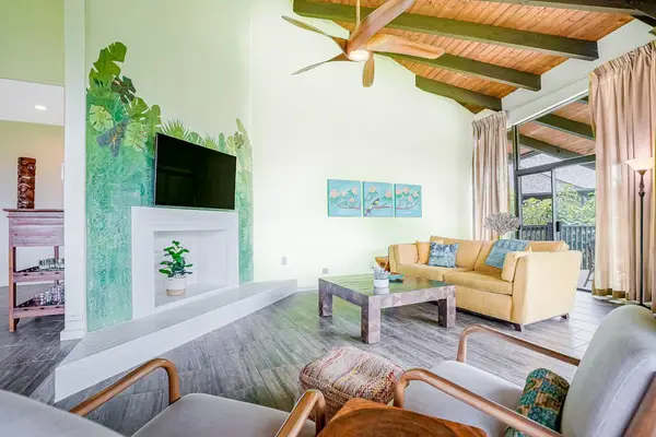 Comfortable living room with tropical décor and ceiling fan