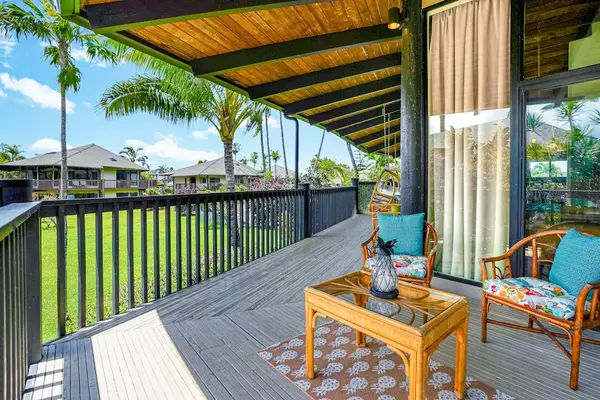 Private lanai with comfortable seating, ideal for morning coffee
