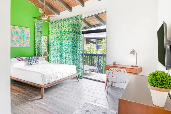 Bright king bedroom with vibrant tropical accents