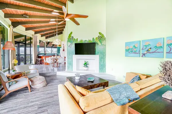 Open-concept living space with tropical accents