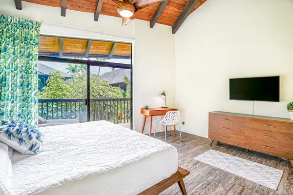 Comfortable king bedroom featuring a private lanai access