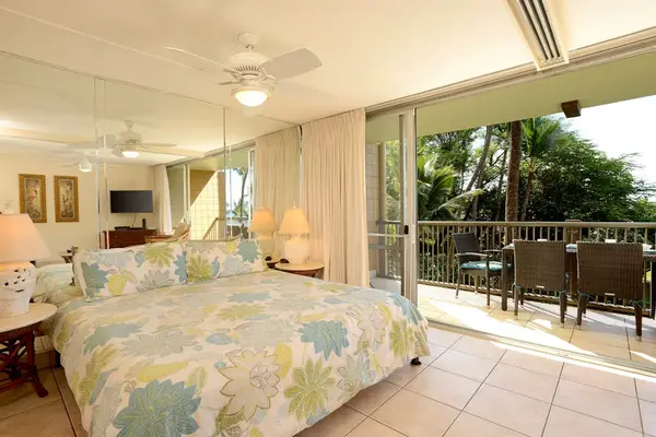 Peaceful bedroom opening to a spacious outdoor lanai