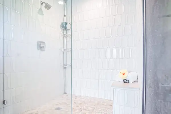 Spa-like primary ensuite bathroom with modern finishes