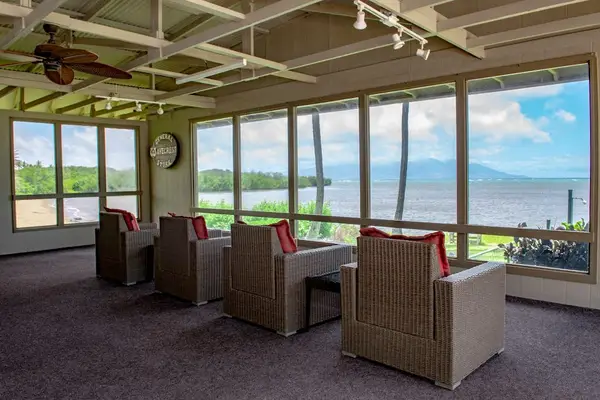 Covered patio offers comfortable seating and sweeping ocean views