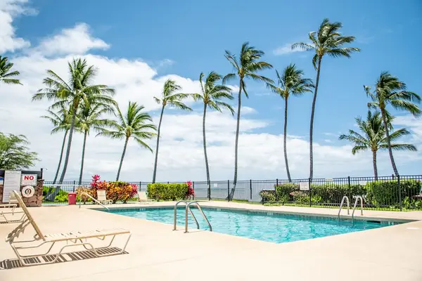 Shared pool area featuring comfortable seating for leisurely afternoons in the sunshine
