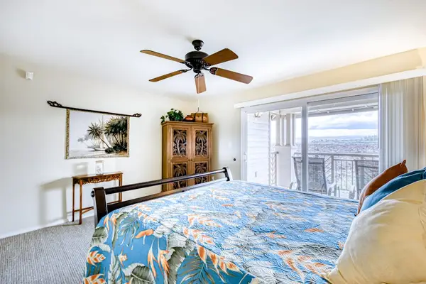 Spacious king bedroom with TV and lanai access