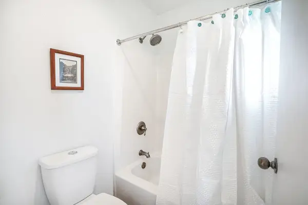 Spotless Bathroom With Shower And Tub