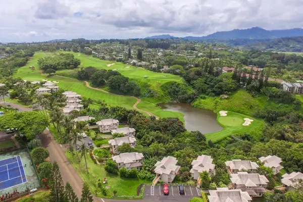 Aerial View Of Lush Fairways And Resort