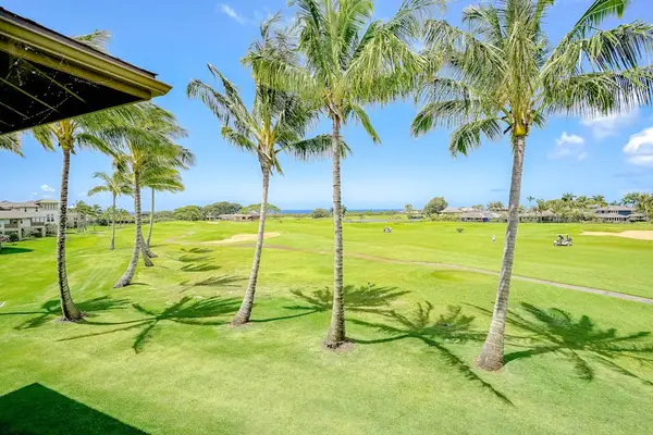Pili Mai Resort with lush tropical views and swaying palm trees.