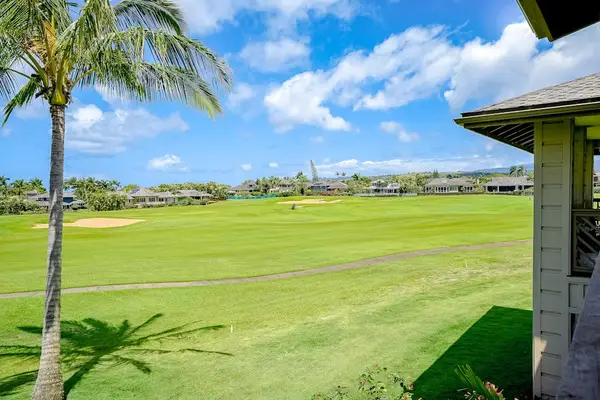 Pili Mai Resort with lush tropical views and swaying palm trees.