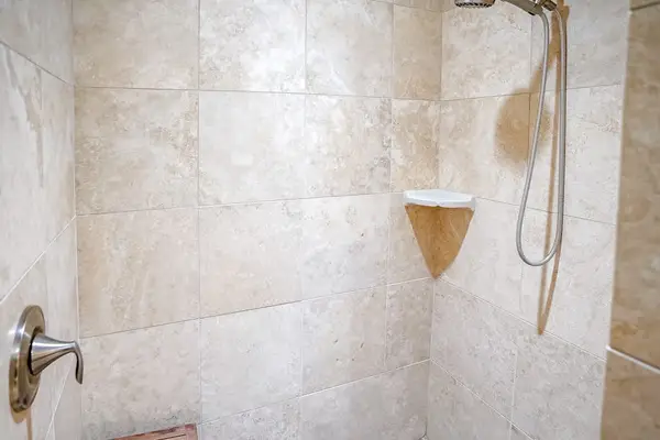 Master shower with spacious walk-in tiled shower.