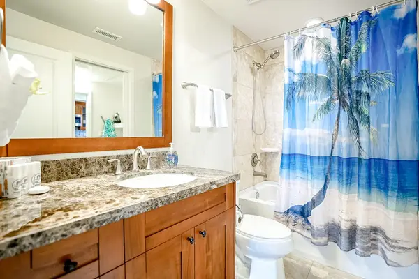 Guest bedroom with tub/shower combo.