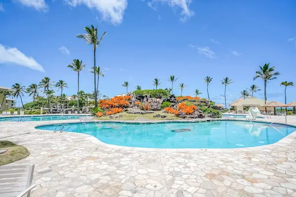 Resort Pool Surrounded By Tropical Gardens