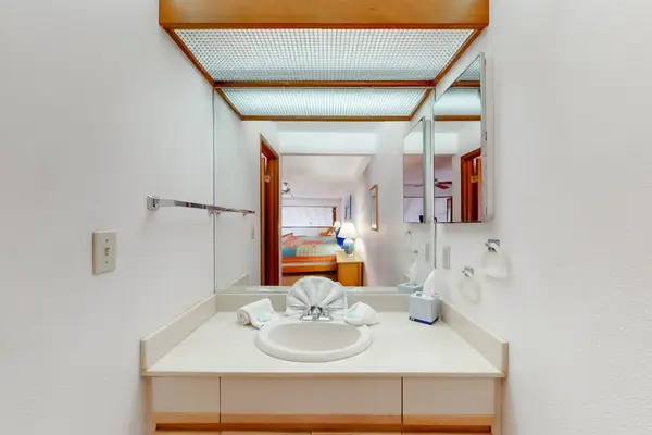 Court area offers open recreation space surrounded by tropical greenery.