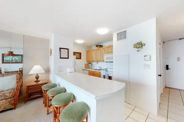Barstools with extra seating at the kitchen counter.