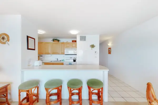 Barstools with extra seating at the kitchen counter.