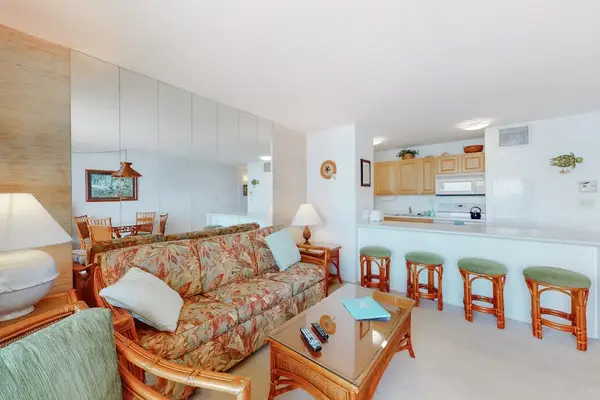 Kitchen open to the living room in this open concept floor plan.