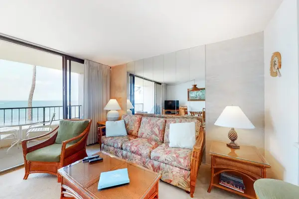 Living room with sleeper sofa and flat screen tv.