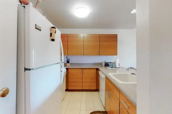 Fully equipped kitchen with warm wood cabinetry