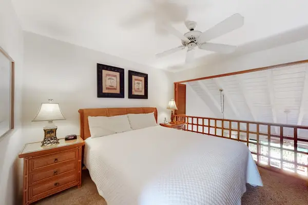 Primary loft bedroom with plantation shutters