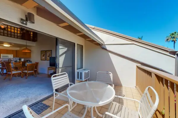 Lanai with outdoor seating and blue skies