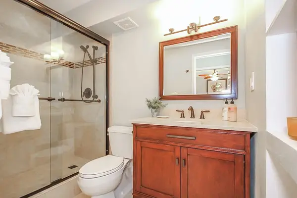 Master bathroom with large tiled walk-in shower.