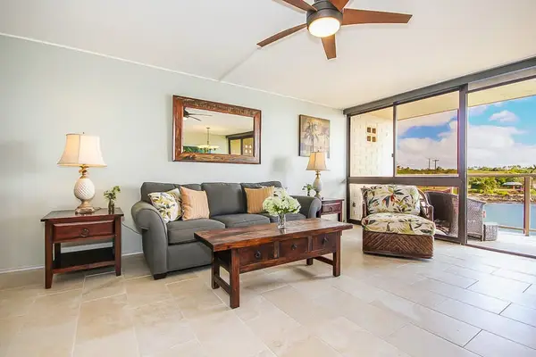 Floor-to-ceiling windows allow you to enjoy the ocean views from the living room, curled up on the couch, or oversized armchair.
