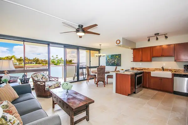 Floor-to-ceiling windows allow you to enjoy the ocean views from the living room, curled up on the couch, or oversized armchair.