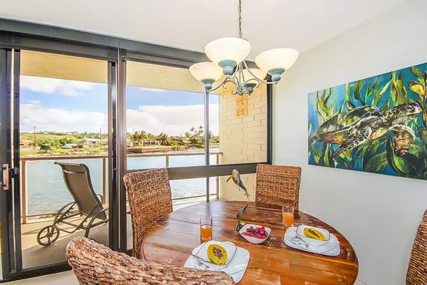 Dining room with table for four for a perfect dinner in with a view of the Pacific Ocean.