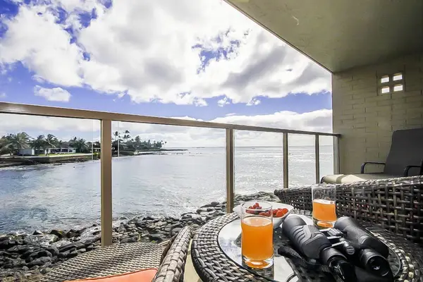 Views of the turquoise waves crashing onto the rocks below from the comfort of your private lanai.