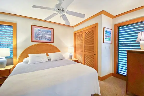 Master bedroom with king bed and flat screen tv.