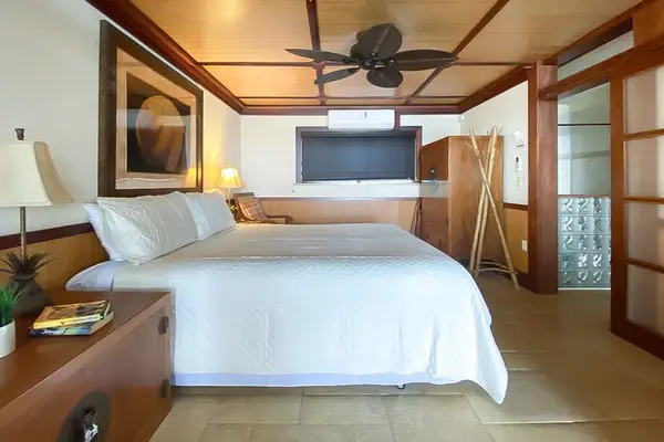 Master bedroom with king bed and a flat screen tv.