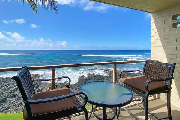 Private lanai with views of the waves of the Pacific Ocean crashing on to the shore.