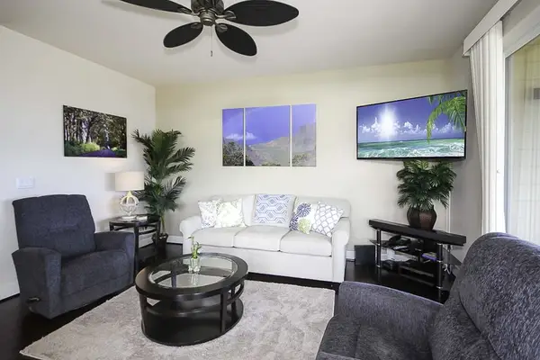 Settle into the bright living room, where you can put your feet up on the couch and two chairs to watch movies on the flatscreen TV. Extra guests? The couch doubles as a queen sleeper sofa. Large picture windows and sliding doors.