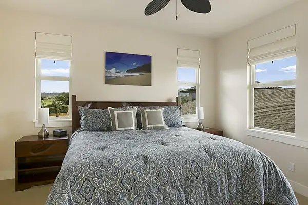 Guest room with king bed and flat screen tv.