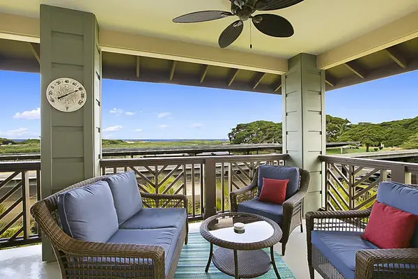 Put an umbrella in your drink and head out to the lanai with distant ocean views. Delve into a good book as the ceiling fan spins lazily above you. A six-person dark wicker patio table begs you to dine al fresco.
