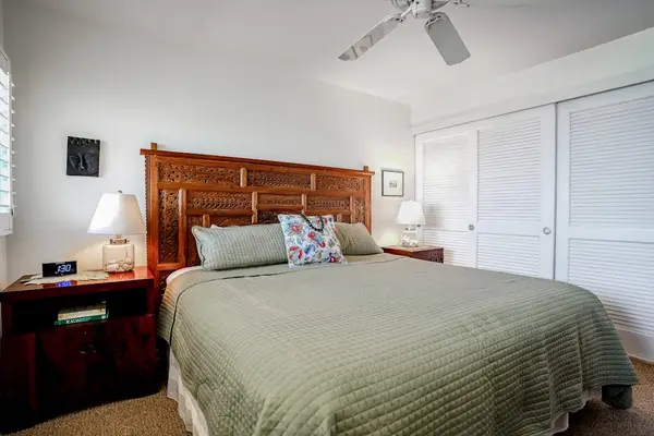 Comfortable bedroom with plantation shutters