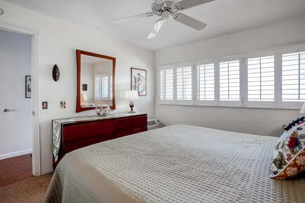 Spacious bedroom with dresser and ample storage