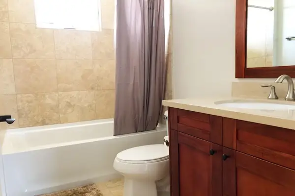 Second bathroom with spacious vanity for daily routines