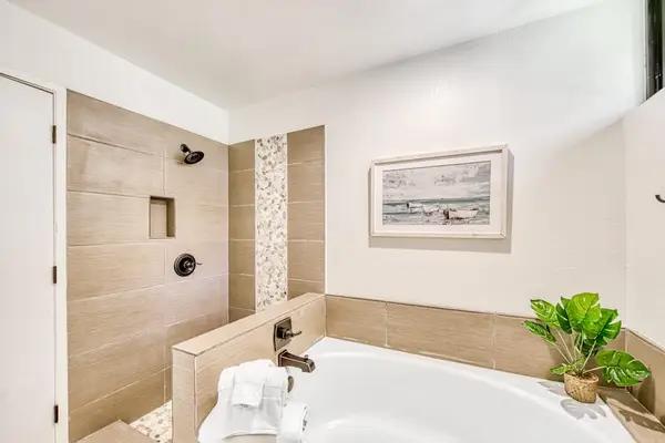 Walk in shower and soaking tub create relaxing bathroom retreat