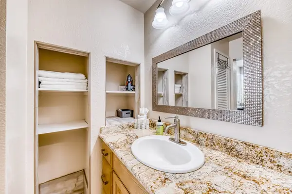 Bathroom vanity with convenient storage and a large mirror