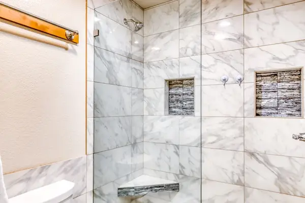 Beautifully tiled walk-in shower for a refreshing start to the day