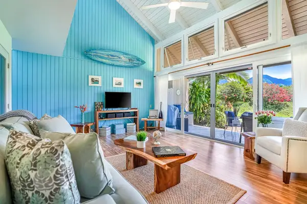 Bright living room with comfortable seating and plenty of natural light.