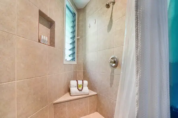 Spacious bathroom with double vanity and ample storage.