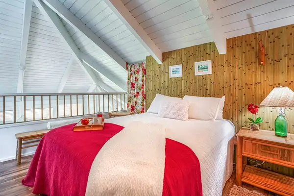 Bright guest bedroom with rustic finishes and natural light.