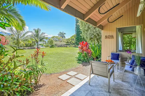 Relax on the covered lanai overlooking the lush tropical gardens.