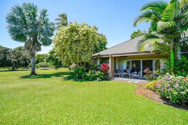 Beautiful exterior view surrounded by expansive green lawns.